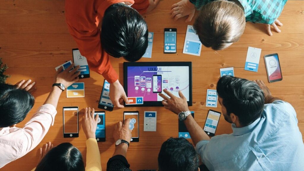 top view software developer team looking ux design from tablet convocation 31965 323065